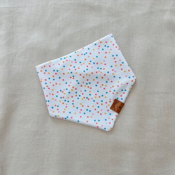 Fresh, fun, and full of color—this white multicolor dots dog bandana is handmade with soft Liverpool textured fabric and adjustable snaps for a perfect fit. A must-have for stylish pups.