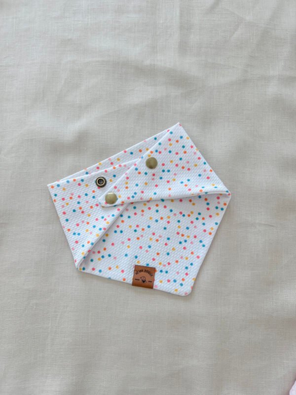 Fresh, fun, and full of color—this white multicolor dots dog bandana is handmade with soft Liverpool textured fabric and adjustable snaps for a perfect fit. A must-have for stylish pups.