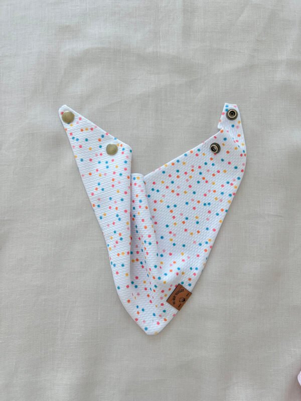 Fresh, fun, and full of color—this white multicolor dots dog bandana is handmade with soft Liverpool textured fabric and adjustable snaps for a perfect fit. A must-have for stylish pups.